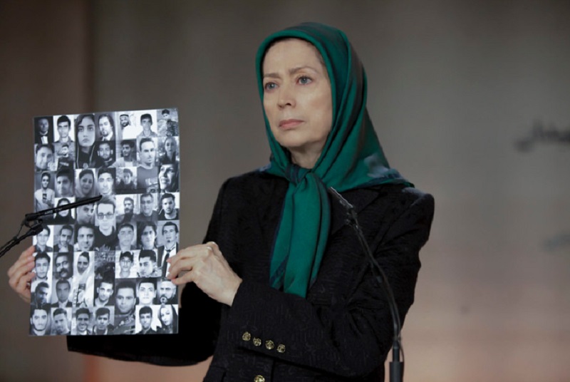 Maryam Rajavi shows the images of protesters who were killed by Iran security forces at the ceremony of 40th day of martyrdom of the victims of the November uprising