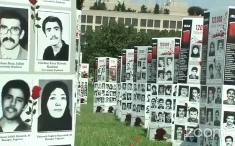The NCRI's exhibition in front of the congress commemorating the 32nd anniversary of the massacre of 30,000 political prisoners by the ayatollahs
