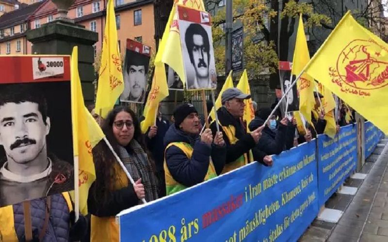 Iranians, supporters of the NCRI rally in Stockholm, Sweden in front of the court convicting Hamid Nouri one of the perpetrators of the 1988 massacre.