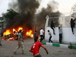 Angry Iranian people attacking a Basiji base, one of the regime’s main repressive forces